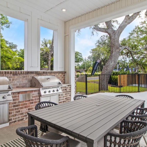 a large outdoor patio with a table and chairs