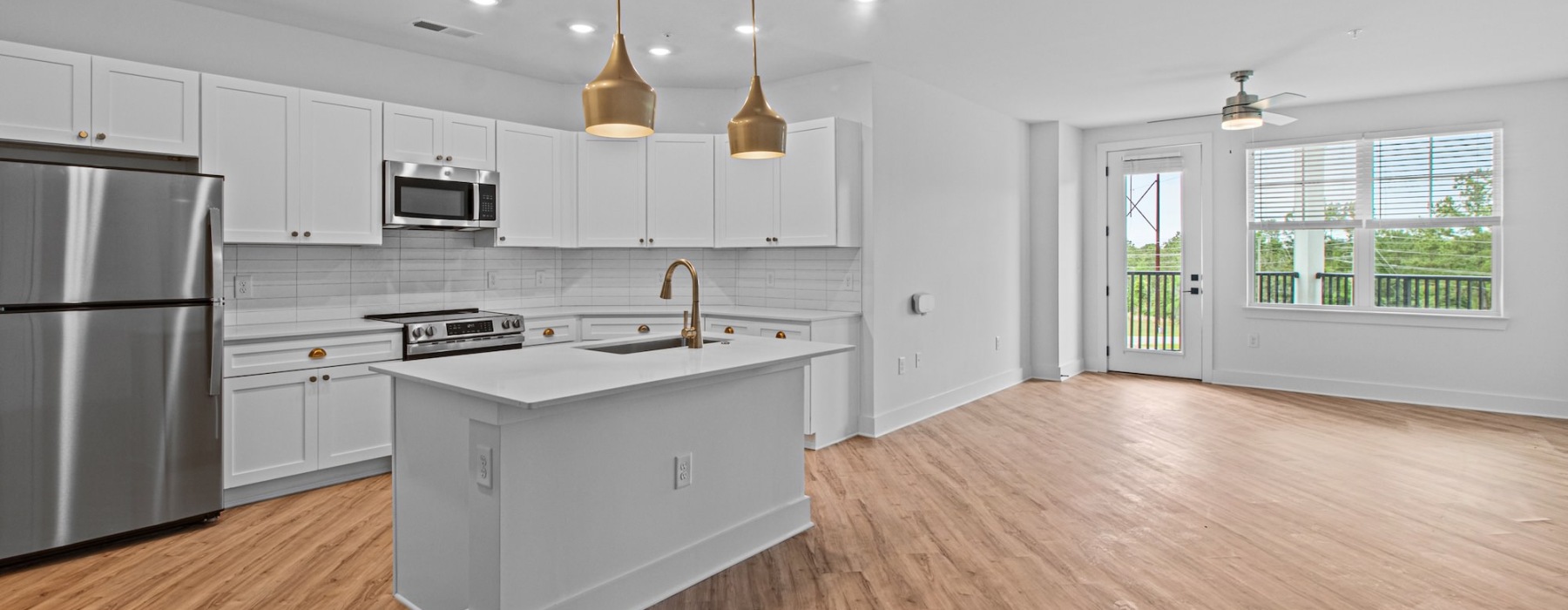a kitchen with white cabinets