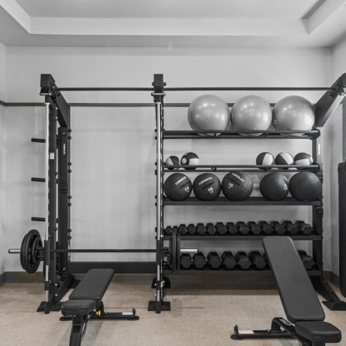 a room with a shelf and chairs