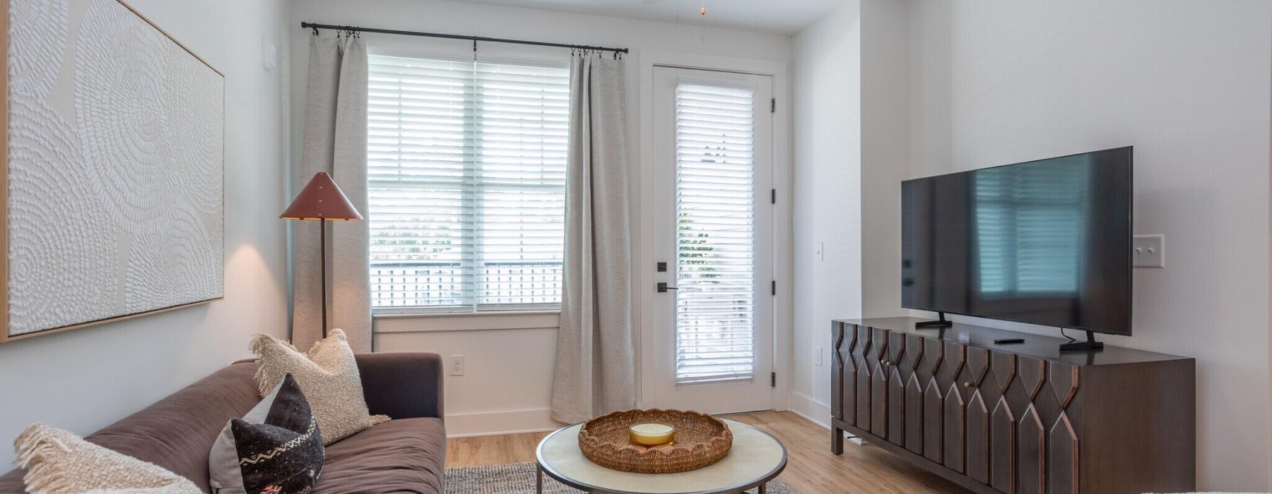 a living room with a tv and couches